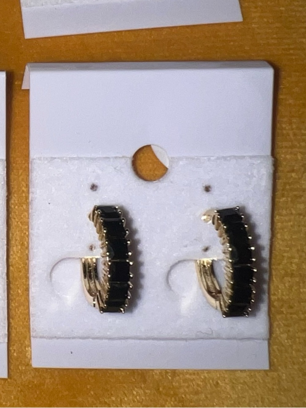 Gold-Tone Hoop Earrings with Black Stone Accents
